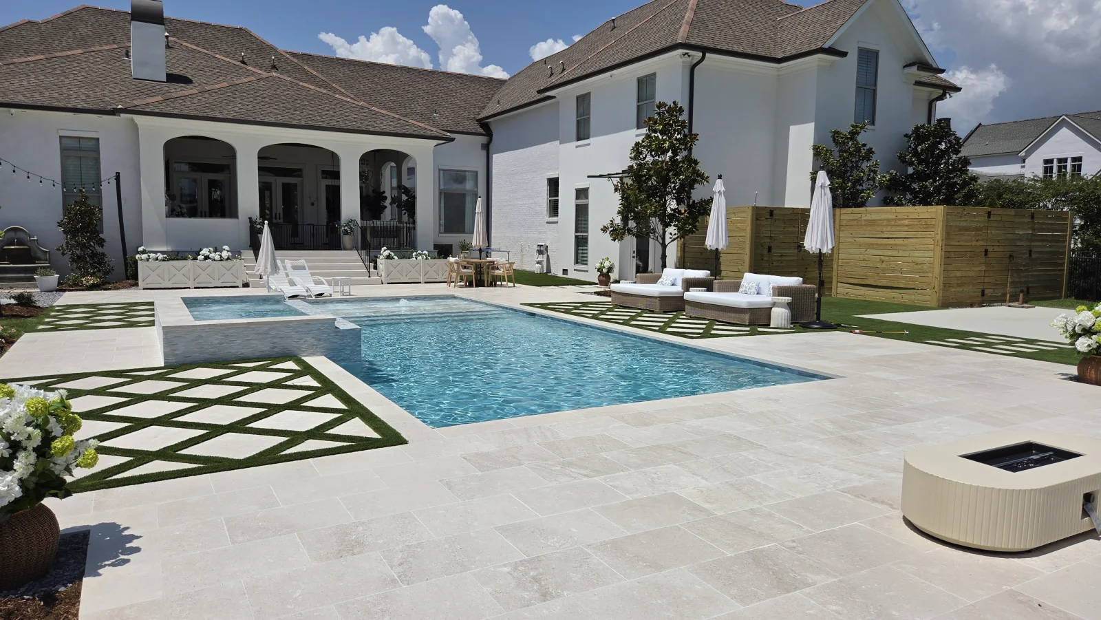 Completed custom pool and spa overlooking the water in a Cypress Pools & Outdoors project